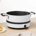 اجاق القایی شیائومی نسخه لایت | Mi Induction Cooker Lite با طراحی مدرن، تنظیم 9 سطحی دما و توان 2100 وات، انتخابی مناسب برای پخت و پز سریع و ایمن است.